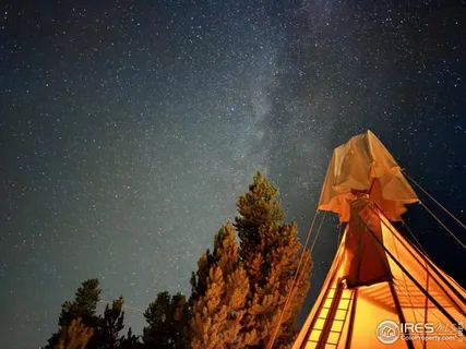 a view of a roof deck with table and chairs