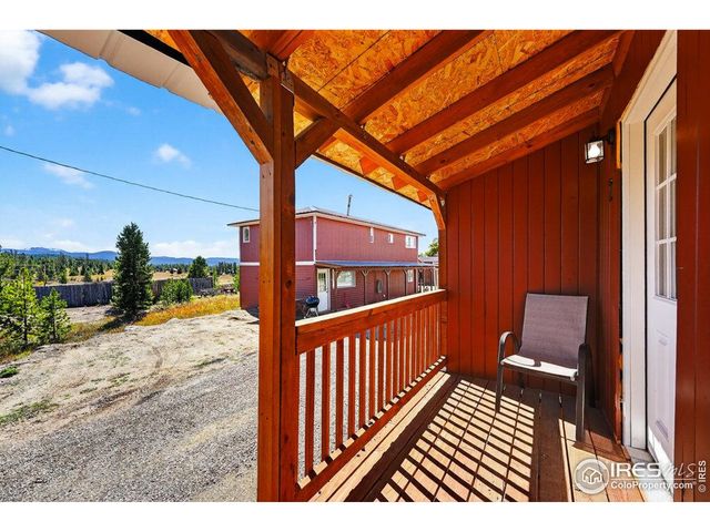a view of a swimming pool with a table and chairs