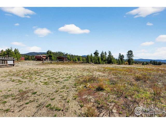 a view of a city from a balcony with a lake