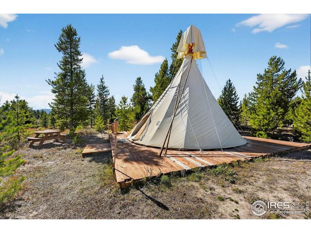 a view of a balcony with wooden floor