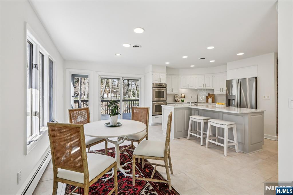 11 Carlough Road Upper Saddle River, NJ 07458 - Photo 13 of 41 a view of a dining room with furniture window and wooden floor
