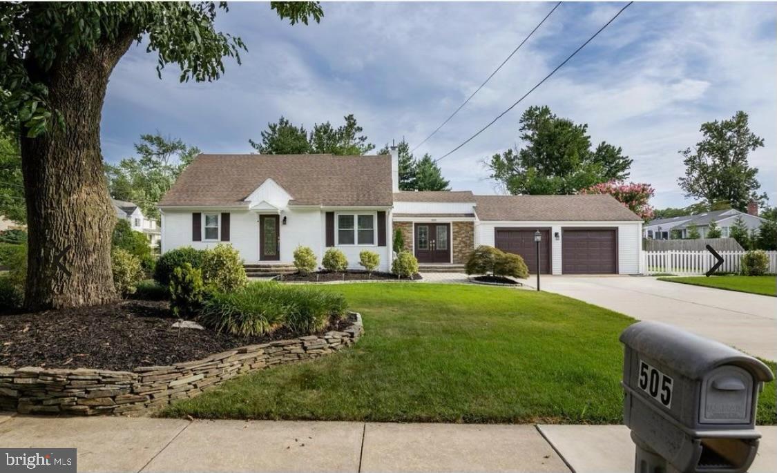 505 East Evesham Road Voorhees, NJ 08043 - Photo 1 of 18 a front view of a house with a garden