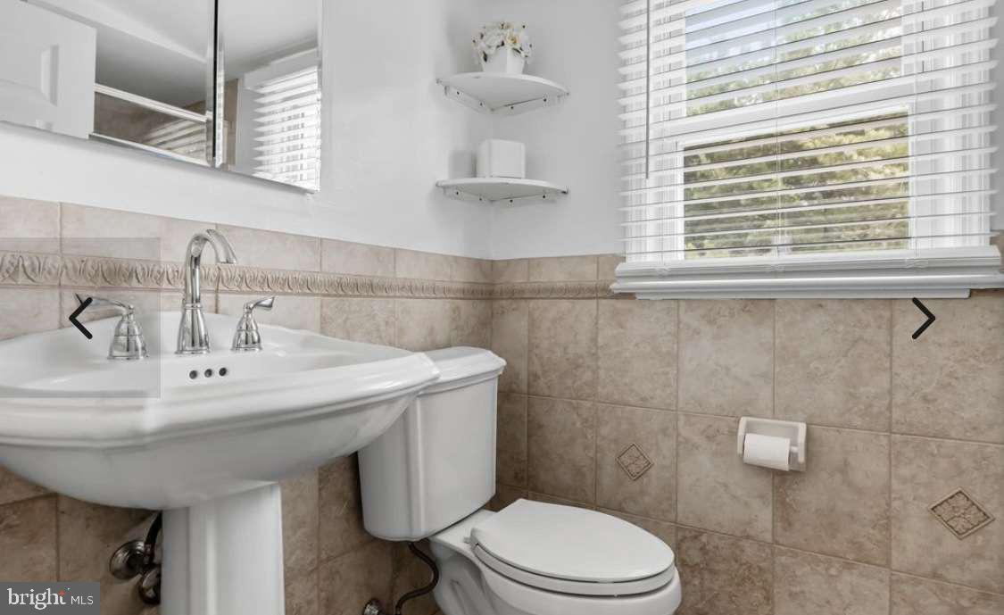 505 East Evesham Road Voorhees, NJ 08043 - Photo 12 of 18 a bathroom with a sink a toilet and a mirror