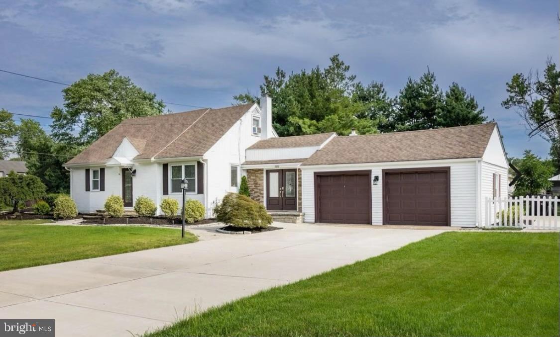 505 East Evesham Road Voorhees, NJ 08043 - Photo 2 of 18 a front view of a house with a yard and potted plants