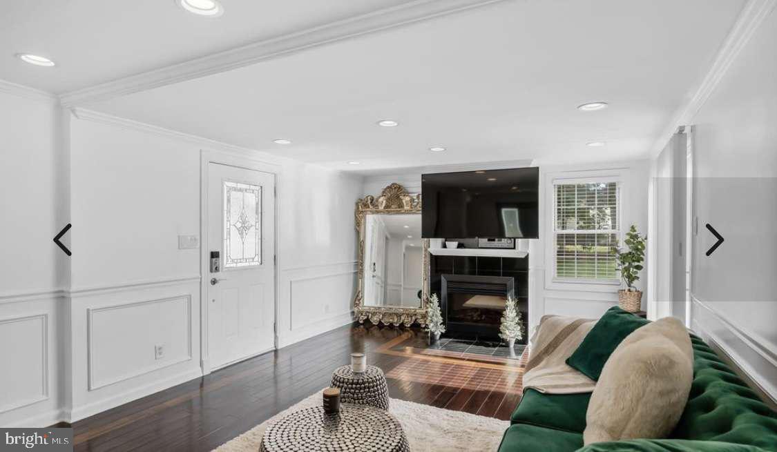 505 East Evesham Road Voorhees, NJ 08043 - Photo 4 of 18 a living room with furniture a fireplace and a flat screen tv