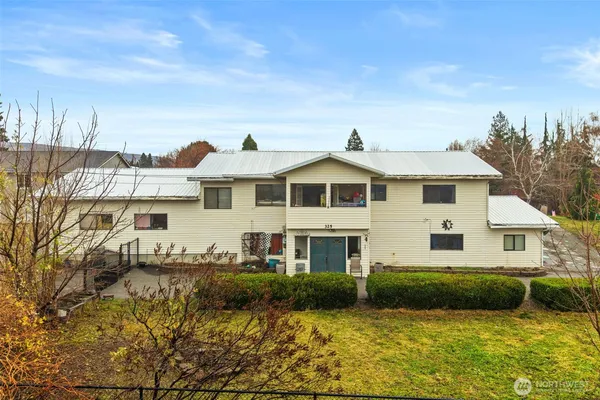 a front view of a house with a yard