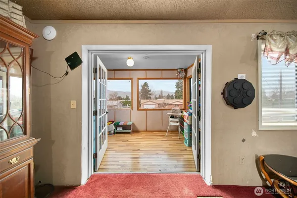 a view of a living room and a balcony