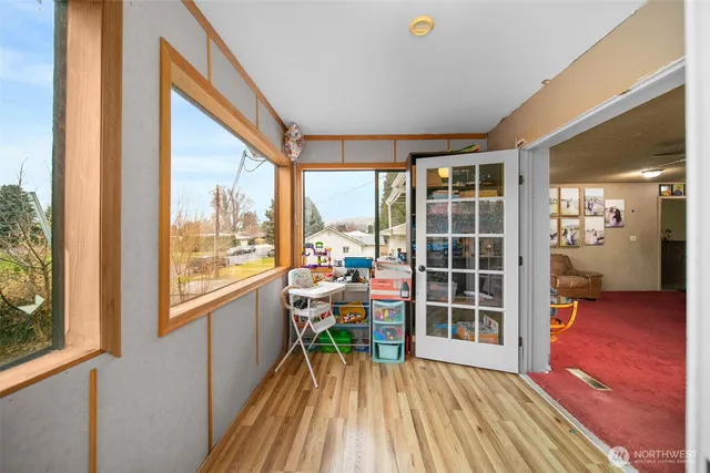 a view of a living room and wooden floor