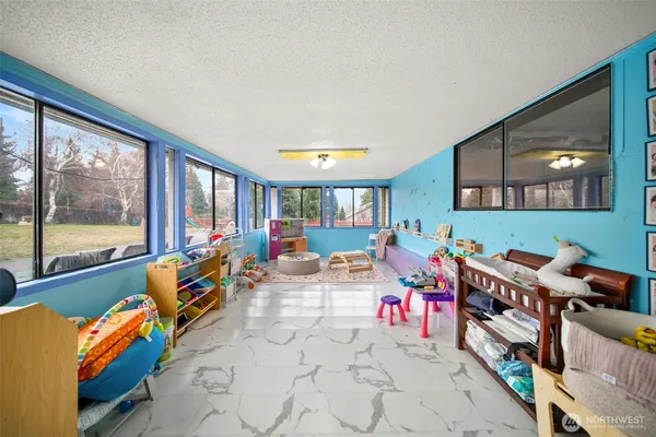 a room with lots of furniture and windows