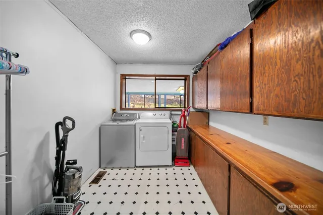 a kitchen that has a sink and a stove in it