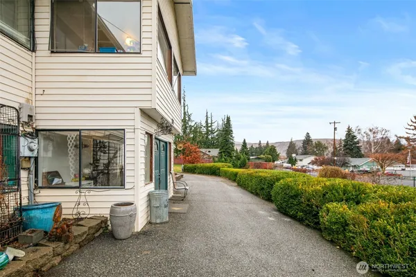 a view of a patio with couches and potted plants