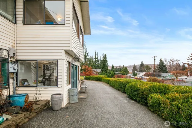 a view of a patio with couches and potted plants