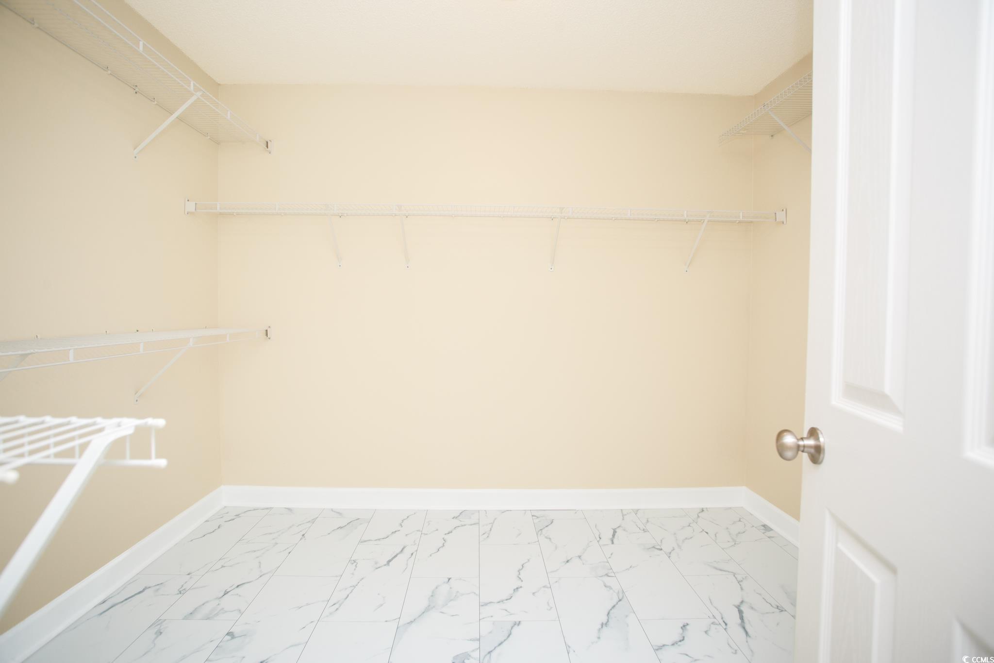 112 Molinia Drive Murrells Inlet, SC 29576 - Photo 27 of 40 Primary bedroom walk-in closet