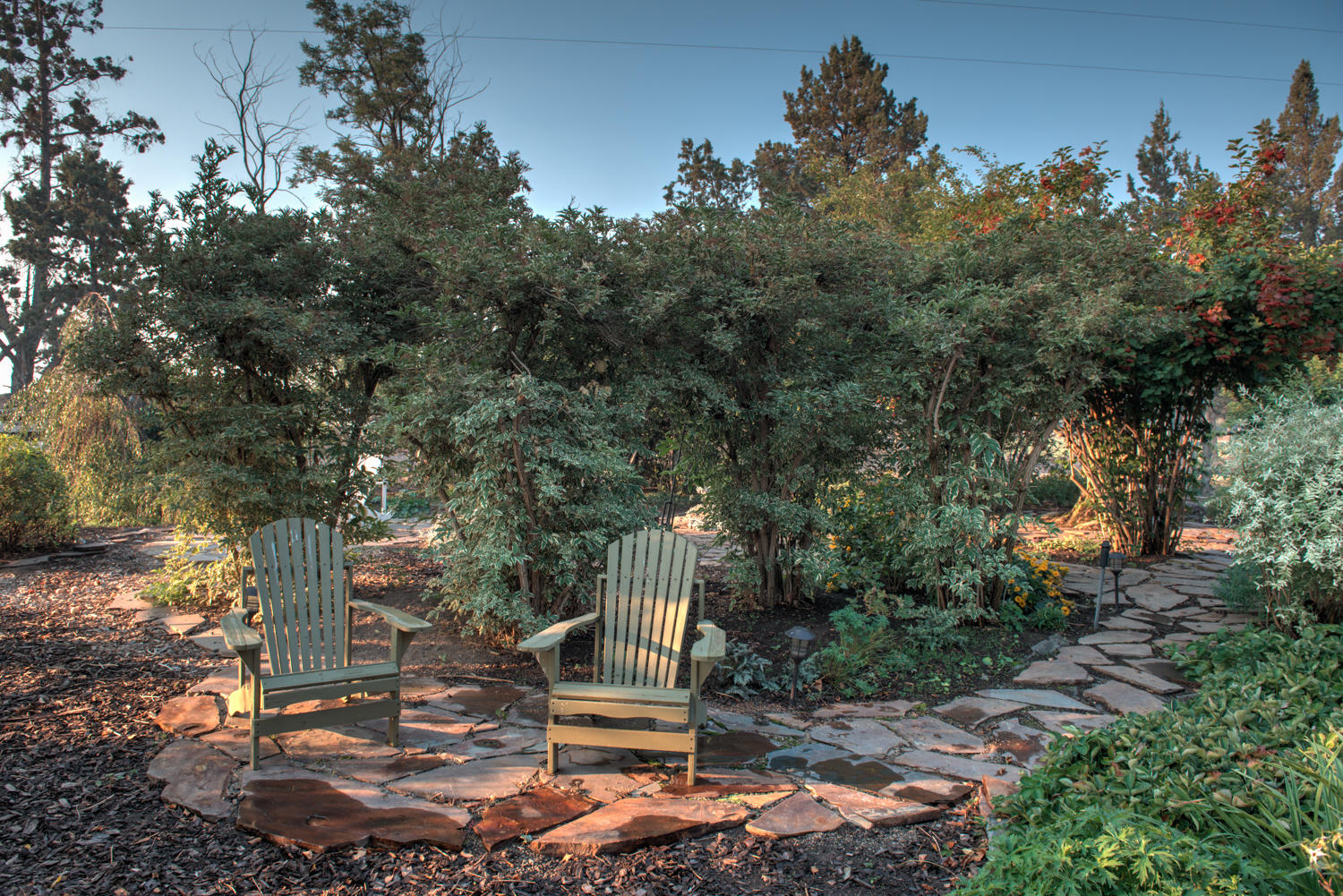 22222 Erickson Road Bend, OR 97701 - Photo 67 of 100 a backyard of a house with outdoor seating