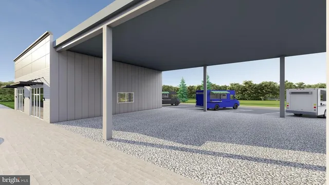 a view of a house with backyard and road