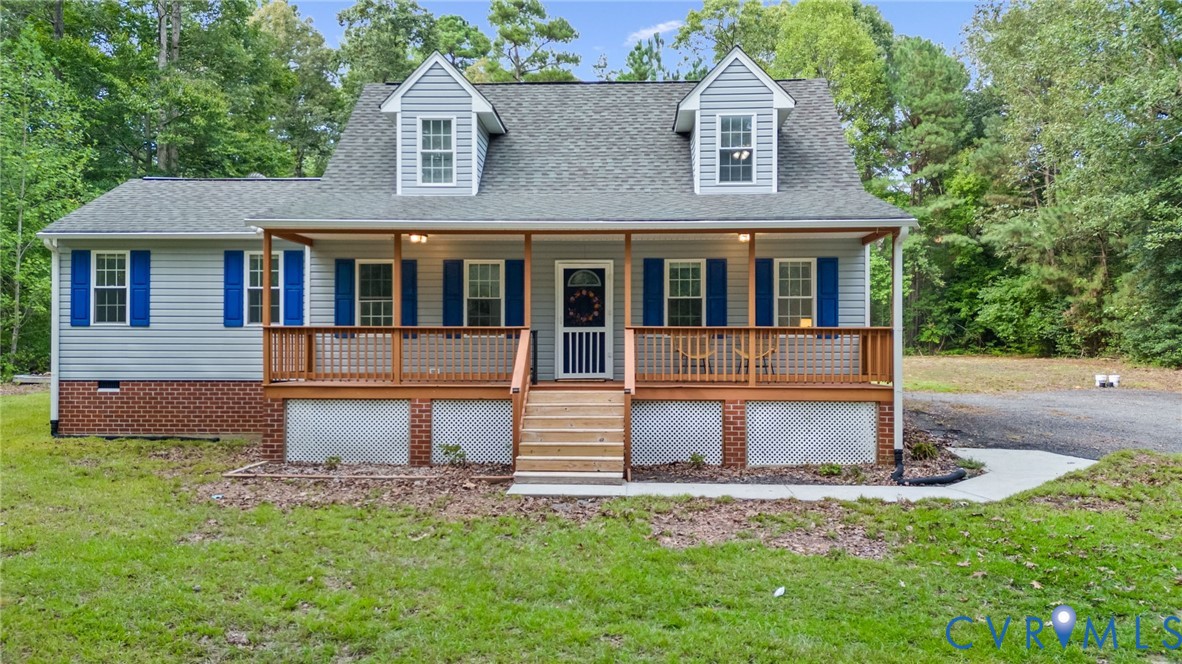 Light blue siding exterior with a covered porch, d