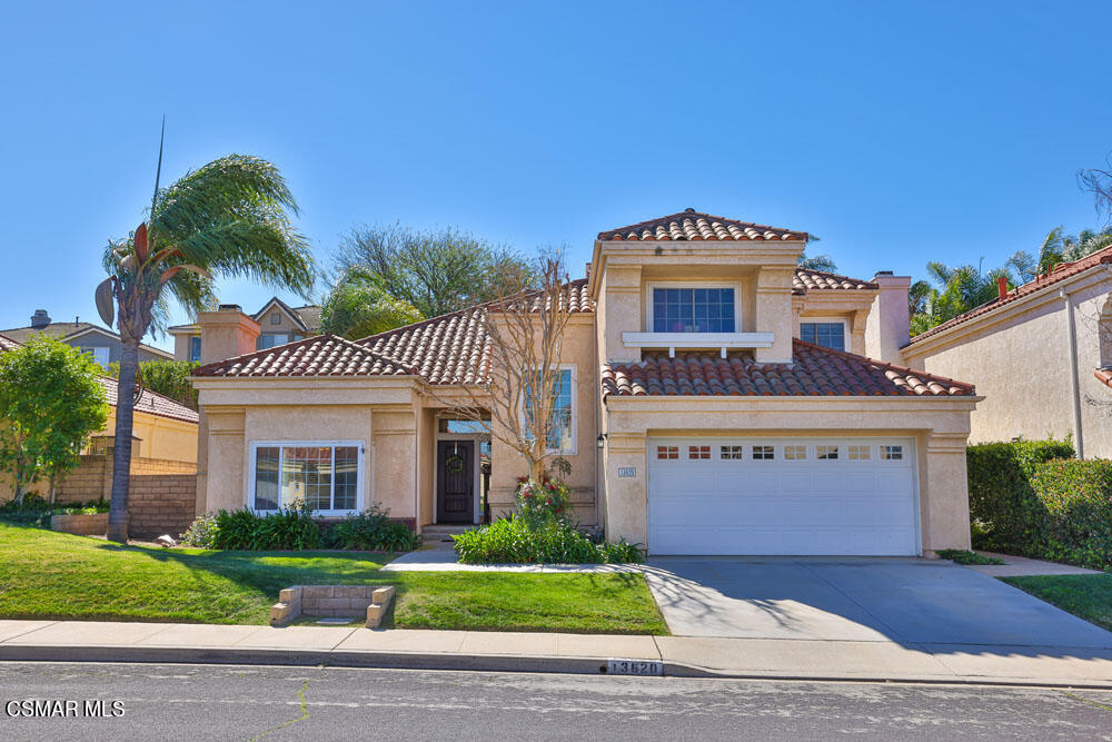 13620 Chesterfield Drive Moorpark, CA 93021 - Photo 2 of 52 a front view of a house with a yard and garage