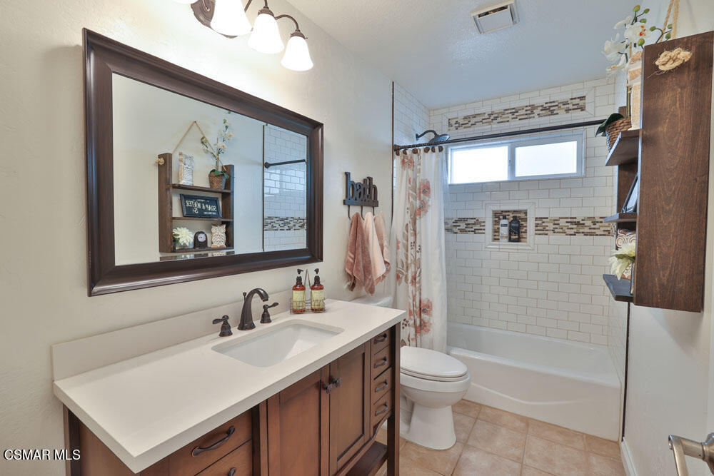 13620 Chesterfield Drive Moorpark, CA 93021 - Photo 27 of 52 a bathroom with a sink toilet double vanity and shower