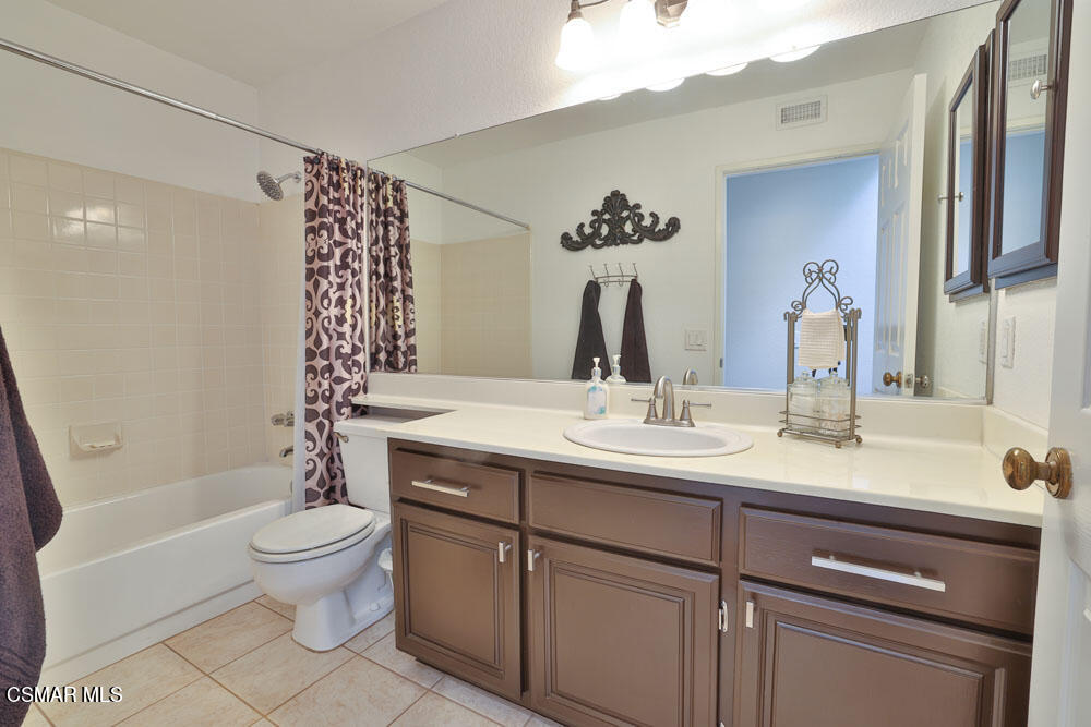 13620 Chesterfield Drive Moorpark, CA 93021 - Photo 33 of 52 a bathroom with a granite countertop sink toilet and shower