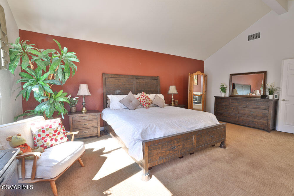 13620 Chesterfield Drive Moorpark, CA 93021 - Photo 38 of 52 a bedroom with a bed potted plant on the dresser and a couch