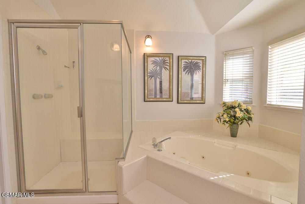 13620 Chesterfield Drive Moorpark, CA 93021 - Photo 42 of 52 a bathroom with a bathtub a shower and a sink