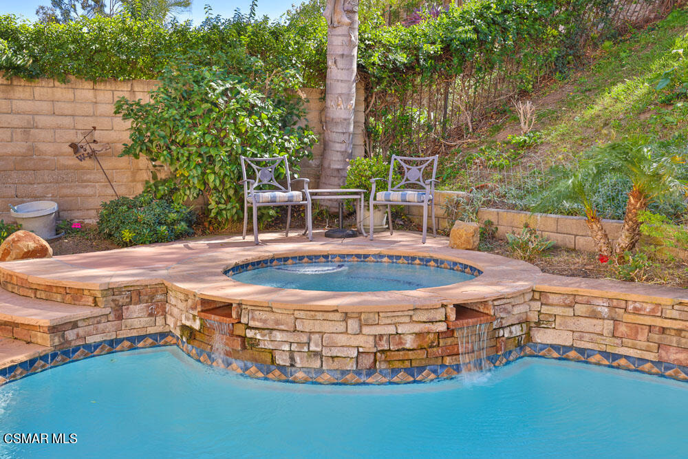 13620 Chesterfield Drive Moorpark, CA 93021 - Photo 48 of 52 a view of a swimming pool with an outdoor space and seating area