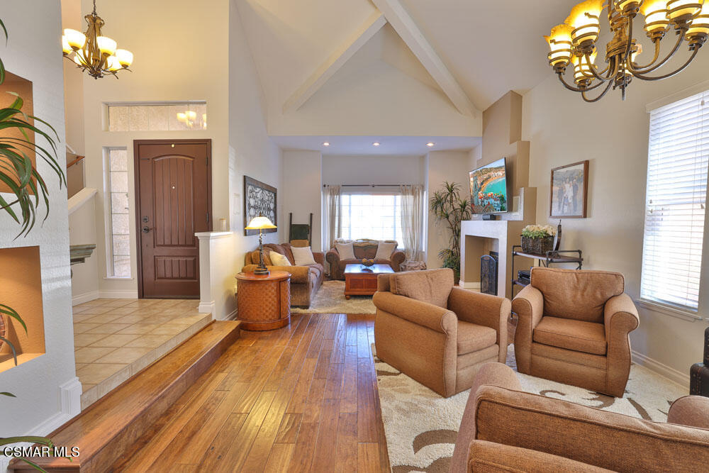 13620 Chesterfield Drive Moorpark, CA 93021 - Photo 10 of 52 a living room with furniture a fireplace and a chandelier