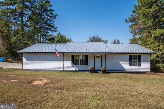 front view of a house with a yard