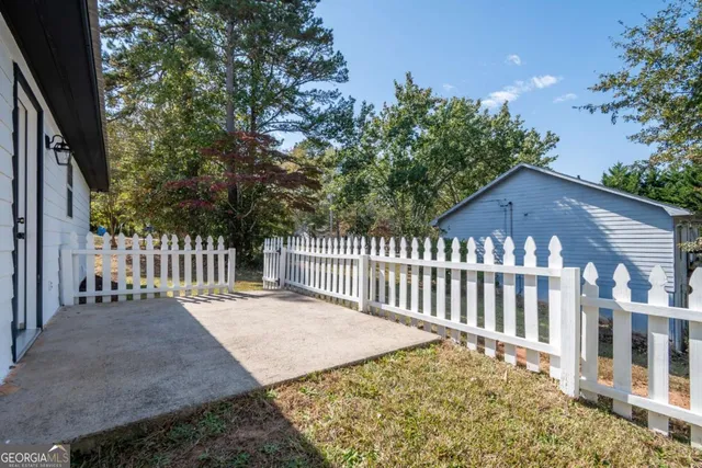 a view of a wooden fence