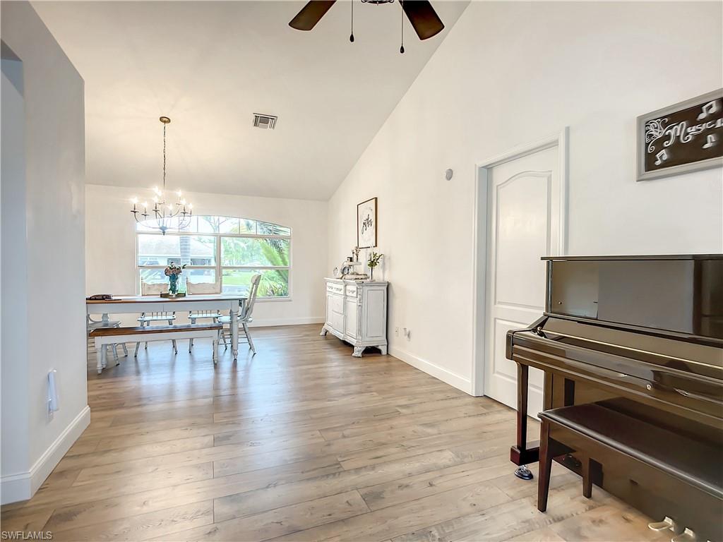 10231 Boca Circle Naples, FL 34109 - Photo 11 of 44 a view of a livingroom with furniture and a piano