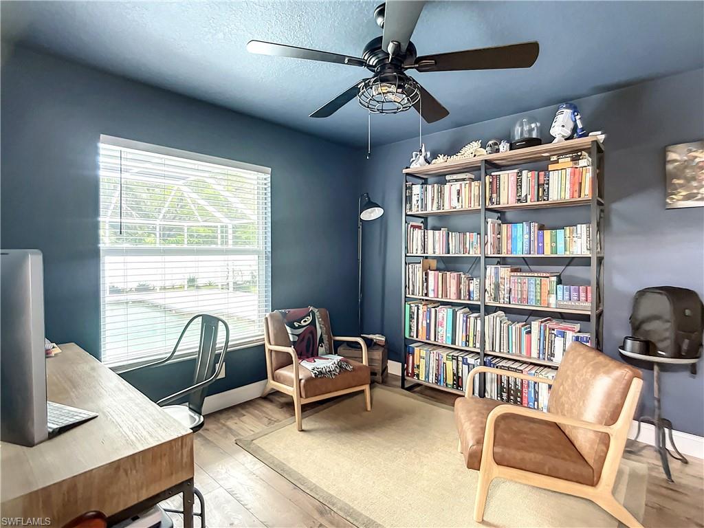 10231 Boca Circle Naples, FL 34109 - Photo 27 of 44 a work room with furniture and a book shelf