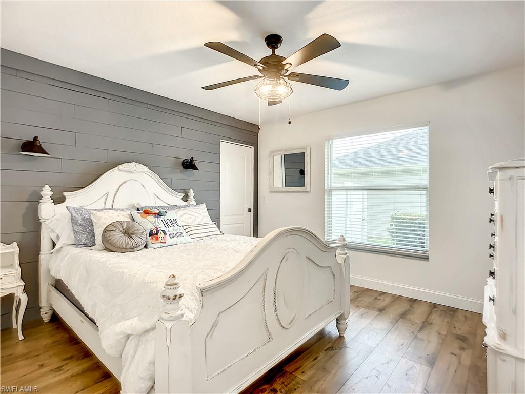 10231 Boca Circle Naples, FL 34109 - Photo 30 of 44 a bedroom with a bed and a window