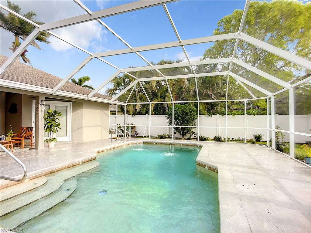 10231 Boca Circle Naples, FL 34109 - Photo 36 of 44 a view of a patio with a backyard