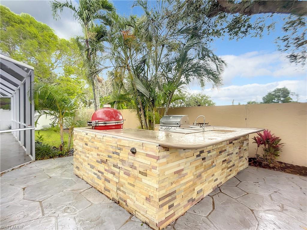 10231 Boca Circle Naples, FL 34109 - Photo 41 of 44 a view of swimming pool with a patio