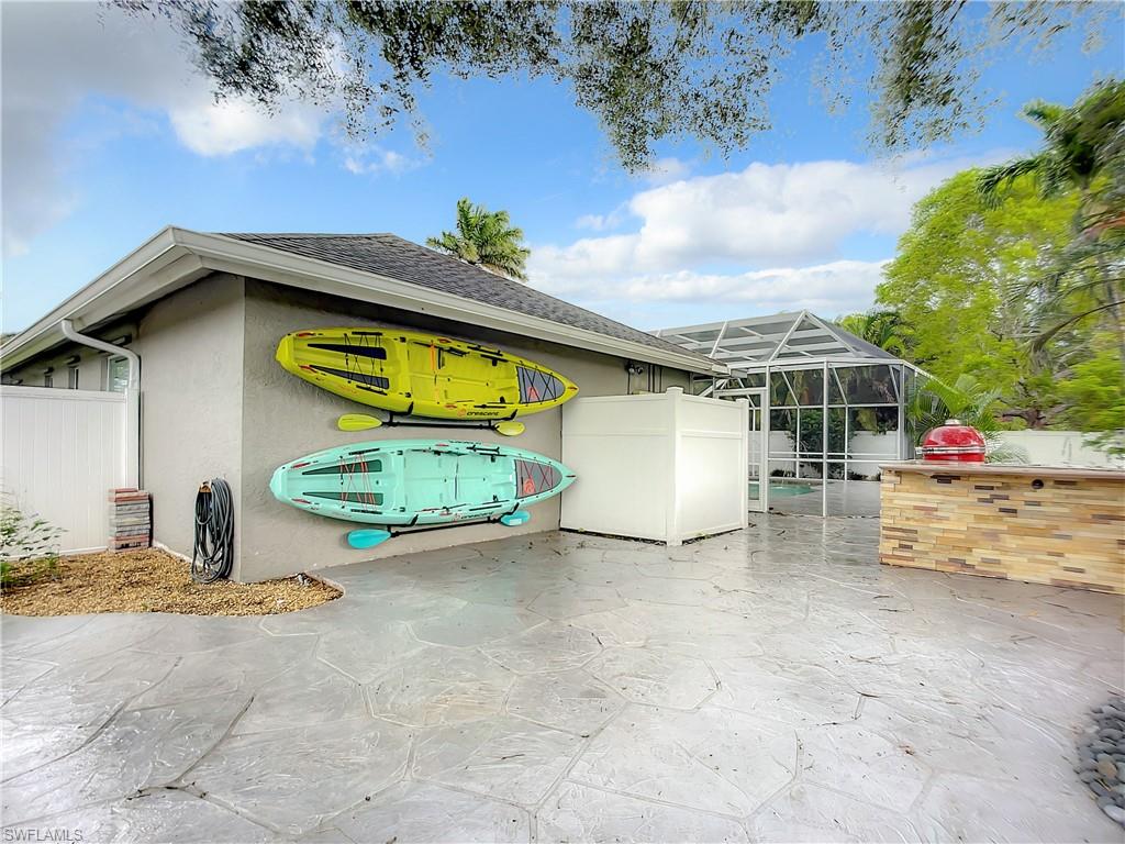 10231 Boca Circle Naples, FL 34109 - Photo 43 of 44 a view of a house with basketball court