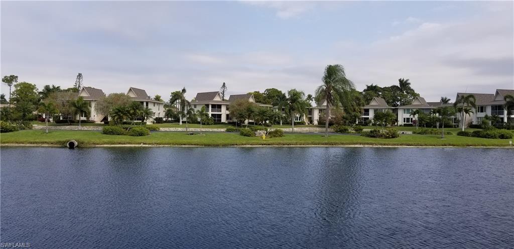 91 Georgetown Boulevard, Unit 91 Naples, FL 34112 - Photo 3 of 22 a view of a town with trees