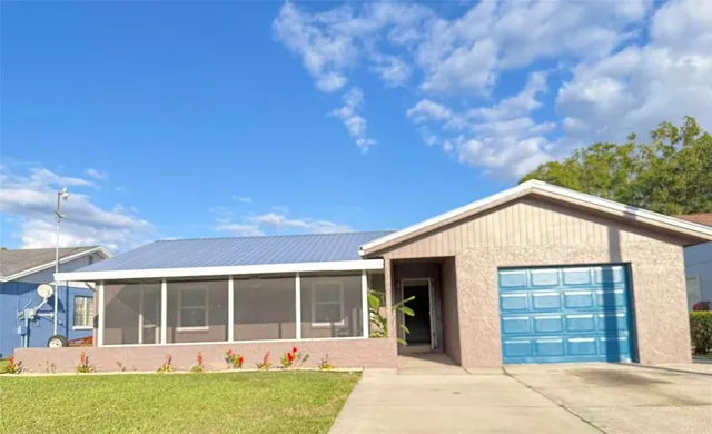 a view of a house with backyard and porch