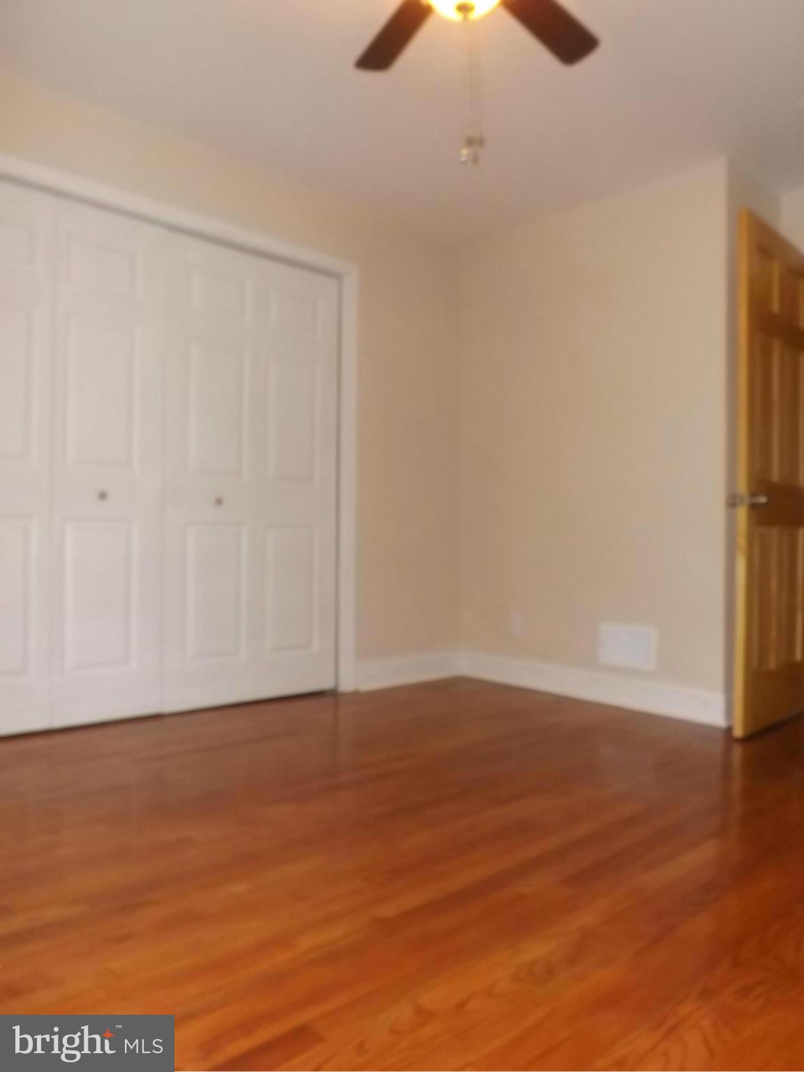 705 St Dunstans Road Baltimore, MD 21212 - Photo 11 of 21 a view of an empty room with wooden floor
