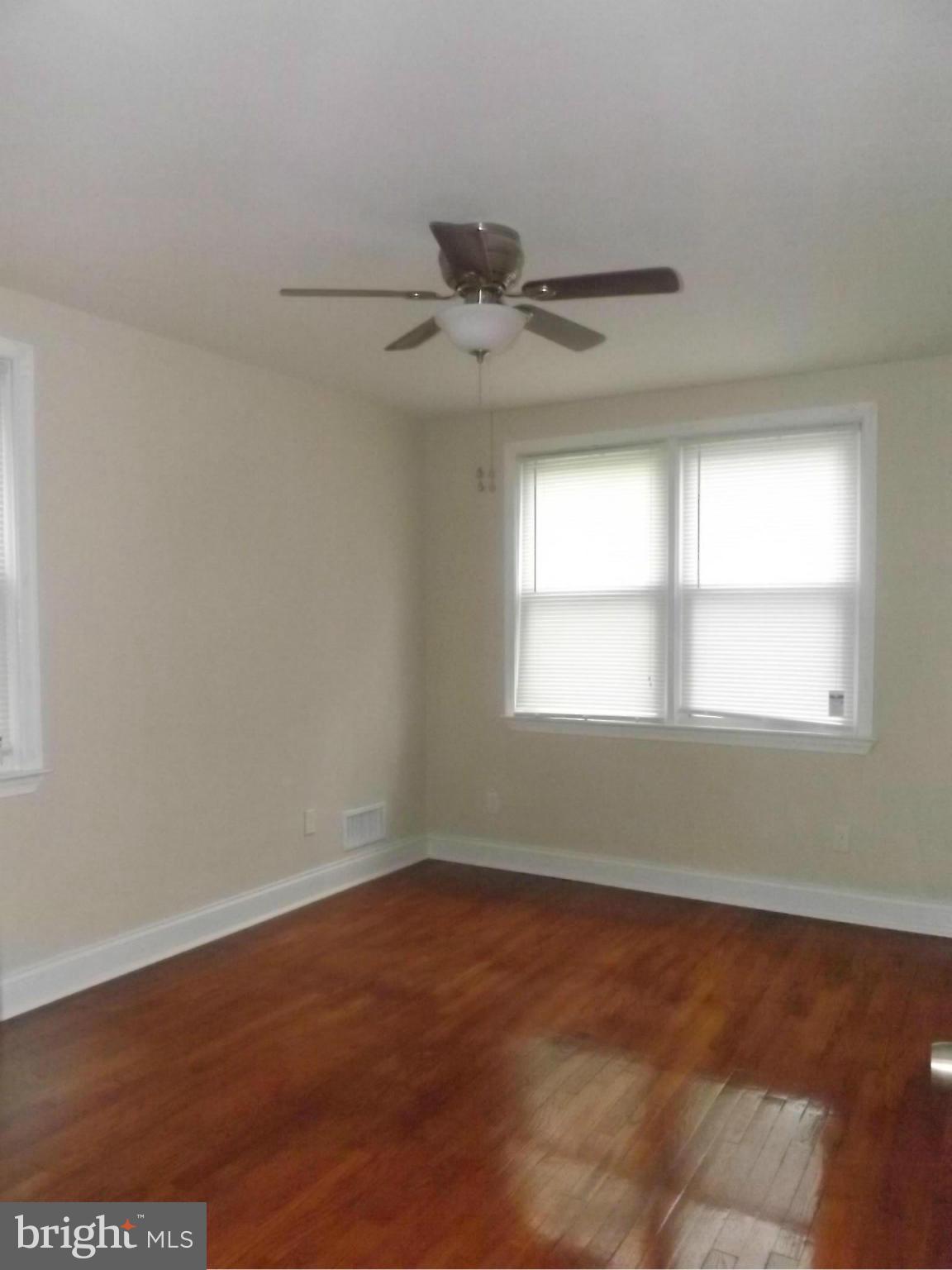 705 St Dunstans Road Baltimore, MD 21212 - Photo 9 of 21 an empty room with a window and a ceiling fan