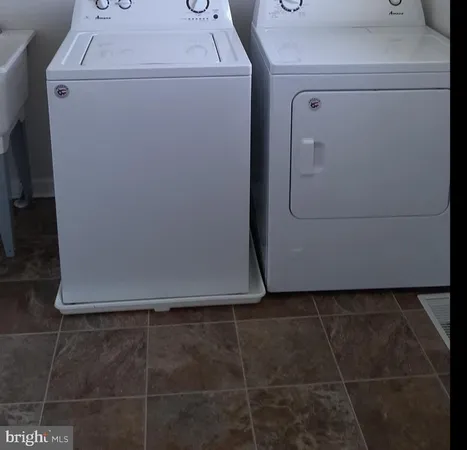 a utility room with dryer and washer
