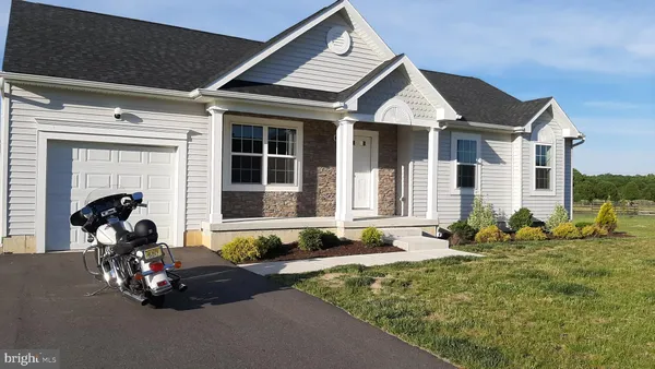 a front view of a house with patio