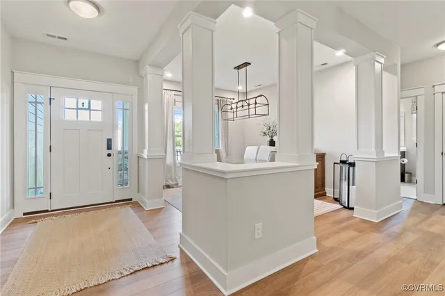 a view of kitchen with furniture and wooden floor