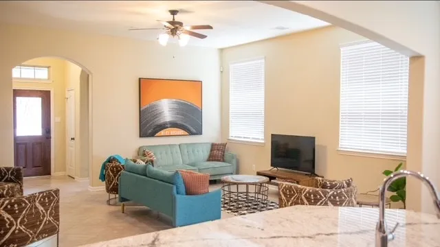 a living room with furniture and a flat screen tv