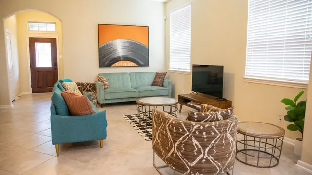 a living room with furniture and a flat screen tv