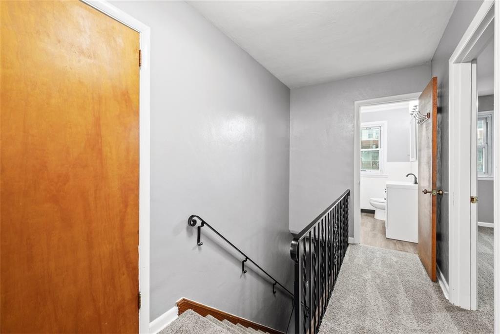 76 Montclair Avenue Pittsburgh, PA 15229 - Photo 17 of 34 a view of a hallway with wooden floor and staircase