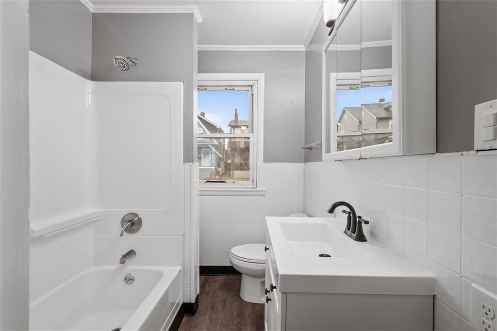 76 Montclair Avenue Pittsburgh, PA 15229 - Photo 18 of 34 a bathroom with a sink a toilet and bathtub