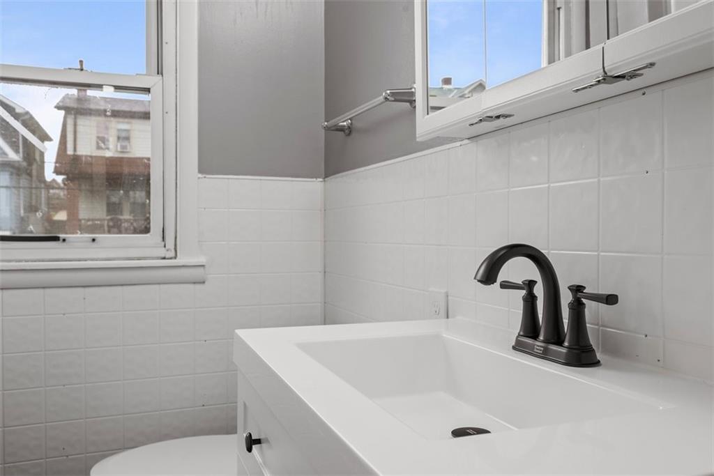 76 Montclair Avenue Pittsburgh, PA 15229 - Photo 19 of 34 a bathroom with a sink and a toilet