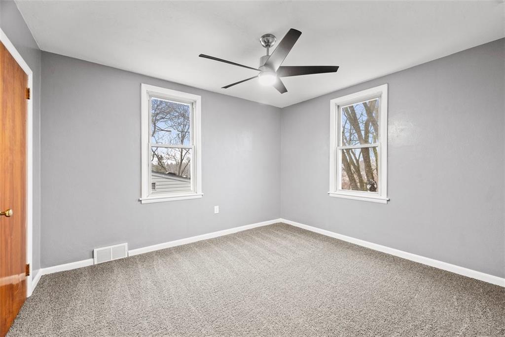 76 Montclair Avenue Pittsburgh, PA 15229 - Photo 23 of 34 an empty room with a window and a ceiling fan