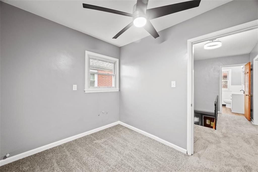 76 Montclair Avenue Pittsburgh, PA 15229 - Photo 24 of 34 an empty room with windows and ceiling fan