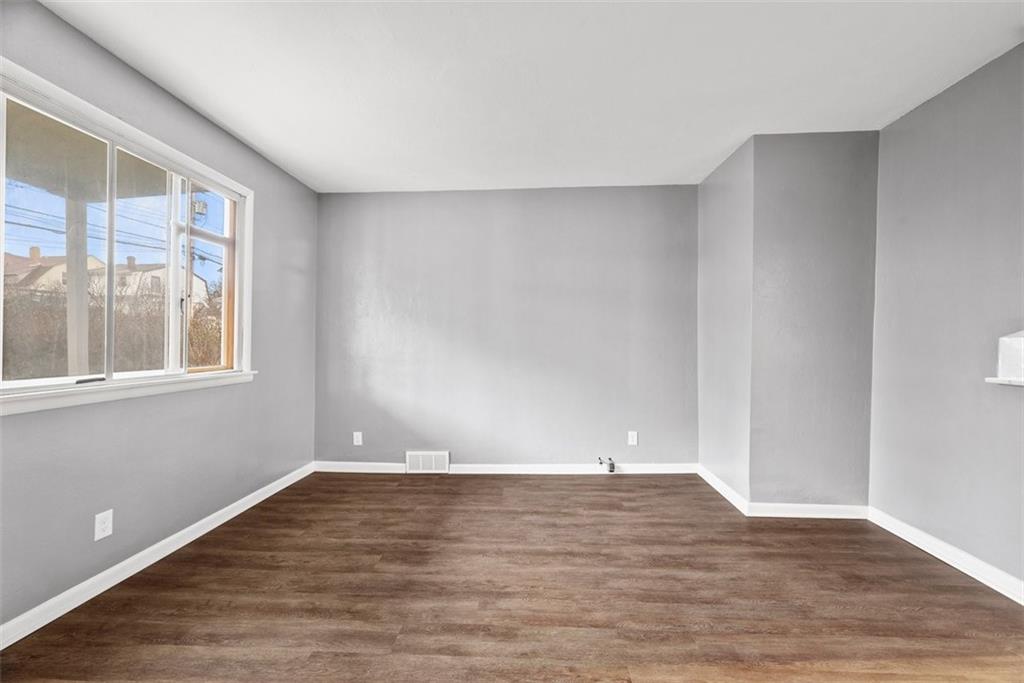 76 Montclair Avenue Pittsburgh, PA 15229 - Photo 4 of 34 a view of an empty room with wooden floor and a window